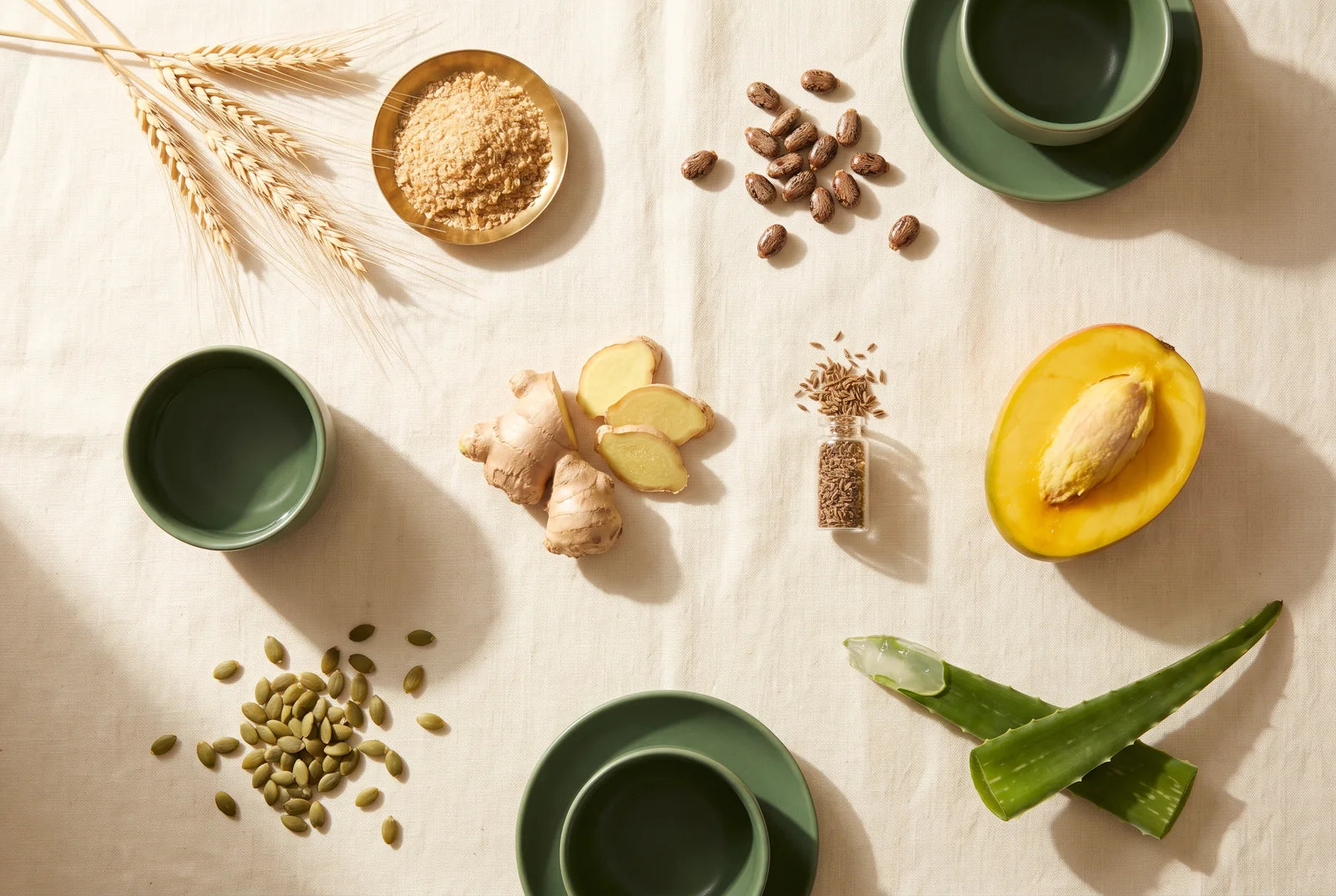 The seven botanicals arranged on cream linen